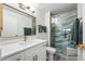 Gorgeous renovated bathroom featuring shower with glass door and stunning stone tiling at 13850 E Marina Dr # 606, Aurora, CO 80014