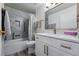 Bright bathroom featuring a soaking tub and modern vanity with bronze hardware at 13850 E Marina Dr # 606, Aurora, CO 80014