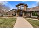 Attractive clubhouse with stone and siding exterior, benches, and well-kept landscaping at 13850 E Marina Dr # 606, Aurora, CO 80014