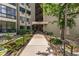 Building entrance showcases landscaped grounds and covered access at 13850 E Marina Dr # 606, Aurora, CO 80014