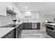 Modern kitchen with stainless steel appliances, custom cabinets, and quartz countertops at 13850 E Marina Dr # 606, Aurora, CO 80014