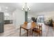 Open concept living room and dining area with wood-look floors and modern finishes at 13850 E Marina Dr # 606, Aurora, CO 80014