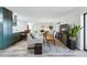 Bright living room features modern décor and an open layout connecting to the kitchen at 13850 E Marina Dr # 606, Aurora, CO 80014