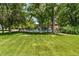 Inviting community pool surrounded by lush greenery and mature trees at 13850 E Marina Dr # 606, Aurora, CO 80014