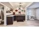 Basement wet bar with cabinetry and shelving at 14461 Mosaic Ave, Parker, CO 80134