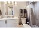 Clean bathroom with toilet, sink, and shower at 14461 Mosaic Ave, Parker, CO 80134