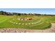 Landscaped area with a stone fire pit and walking paths at 14461 Mosaic Ave, Parker, CO 80134