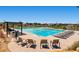 Resort-style pool with lounge chairs and a pergola at 14461 Mosaic Ave, Parker, CO 80134