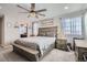 Main bedroom with king-size bed and ensuite bathroom access at 14461 Mosaic Ave, Parker, CO 80134