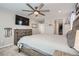 Main bedroom with large bed, dresser, and walk-in closet at 14461 Mosaic Ave, Parker, CO 80134