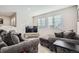 Relaxing sitting area with two sofas, a TV, and a coffee table at 14461 Mosaic Ave, Parker, CO 80134