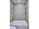 Clean bathroom featuring new tiling and shower at 1821 N Grove St, Denver, CO 80204