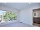 Bright bedroom with large windows offering plenty of natural light and ensuite bathroom at 1821 N Grove St, Denver, CO 80204
