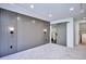 Bedroom featuring a decorative accent wall, recessed lighting, and an ensuite bathroom at 1821 N Grove St, Denver, CO 80204