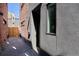 Modern exterior view with brick and dark finishes, gravel, and wood fence at 1821 N Grove St, Denver, CO 80204