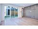 Bright living room with sliding glass doors and modern built-in storage and entertainment unit at 1821 N Grove St, Denver, CO 80204