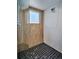 Glass shower with a window and white tile surround, paired with dark tiled floors at 1821 N Grove St, Denver, CO 80204