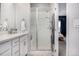 Bathroom showcasing a glass-enclosed shower, and a vanity with modern fixtures at 5371 E 63Rd Pl, Commerce City, CO 80022
