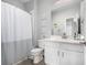Well-lit bathroom with shower/tub, white vanity, and decorative accents at 5371 E 63Rd Pl, Commerce City, CO 80022