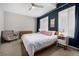 Serene bedroom with natural light, soft bedding, neutral tones, and stylish decor at 5371 E 63Rd Pl, Commerce City, CO 80022