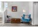 Bright foyer featuring hardwood floors, stylish blue chair, and unique decor details with plenty of light at 5371 E 63Rd Pl, Commerce City, CO 80022
