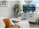 Cozy living room featuring modern console, stylish decor, and a comfortable seating arrangement with natural light at 5371 E 63Rd Pl, Commerce City, CO 80022