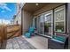 Charming outdoor patio featuring stone pavers and cozy seating, perfect for enjoying the fresh air at 5371 E 63Rd Pl, Commerce City, CO 80022