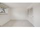 Bright bedroom featuring neutral carpet, a window and a closet at 6323 W Rowland Cir, Littleton, CO 80128