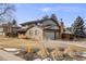 Two-story home with attached garage, neat landscaping and driveway on quiet street at 6323 W Rowland Cir, Littleton, CO 80128