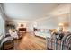 Bright living room with hardwood floors, neutral walls, and comfortable seating at 6323 W Rowland Cir, Littleton, CO 80128