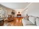 Inviting living room featuring hardwood floors, soft lighting, and comfortable seating arrangement at 6323 W Rowland Cir, Littleton, CO 80128