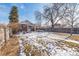 Spacious backyard featuring a pergola, mature trees, and a privacy fence, perfect for outdoor entertaining at 2455 Lowell Blvd, Denver, CO 80211