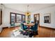 Dining room featuring hardwood floors, large windows, and a vintage feel at 2455 Lowell Blvd, Denver, CO 80211