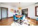 Bright dining area with hardwood floors, stylish light fixture, and decorative artwork at 2455 Lowell Blvd, Denver, CO 80211