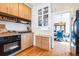 Classic kitchen featuring a gas range, and white subway tile backsplash at 2455 Lowell Blvd, Denver, CO 80211