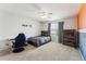 Bright bedroom featuring a bed, desk, and chair at 15967 Butterwort Cir, Parker, CO 80134