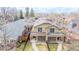 Aerial view of the charming home with a fenced yard and porch at 1653 S Logan St, Denver, CO 80210