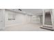 Finished basement providing ample space with good lighting, carpet, and stairway at 1653 S Logan St, Denver, CO 80210