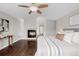 Inviting bedroom featuring a cozy fireplace and natural light at 1653 S Logan St, Denver, CO 80210