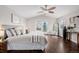 Bright bedroom with a ceiling fan, balcony, and comfortable bed at 1653 S Logan St, Denver, CO 80210