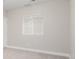 Empty bedroom with window and neutral paint at 1653 S Logan St, Denver, CO 80210