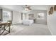 Bright bedroom with vaulted ceilings, neutral tones and natural light from the windows at 1653 S Logan St, Denver, CO 80210