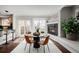 Eat-in kitchen with a glass table, leather chairs and fireplace at 1653 S Logan St, Denver, CO 80210