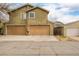Exterior facade of the home with garage doors and driveway at 1653 S Logan St, Denver, CO 80210
