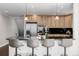 Bright kitchen bar with hardwood floors and stainless steel appliances at 1653 S Logan St, Denver, CO 80210