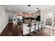 Well-lit kitchen has bar seating and stainless steel appliances at 1653 S Logan St, Denver, CO 80210