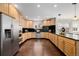 Spacious kitchen with stainless steel appliances and sleek black countertops at 1653 S Logan St, Denver, CO 80210