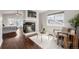 Cozy living room featuring a fireplace, modern furniture, and a bright window at 1653 S Logan St, Denver, CO 80210