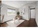 Bright living room with a large window, modern decor, and hardwood floors at 1653 S Logan St, Denver, CO 80210