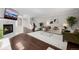 Open living room with a fireplace, hardwood floors, and stairs leading to the second floor at 1653 S Logan St, Denver, CO 80210